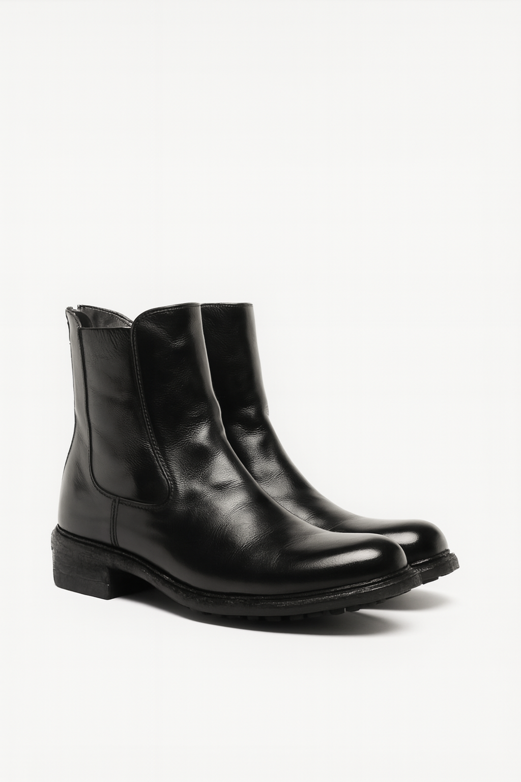 Pair of black leather boots on a white background