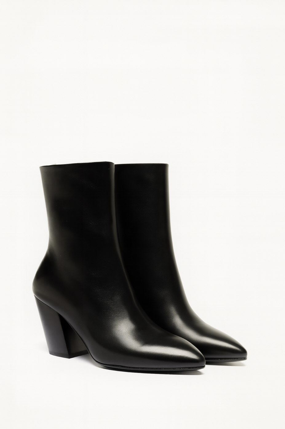 Pair of black ankle boots on a white background