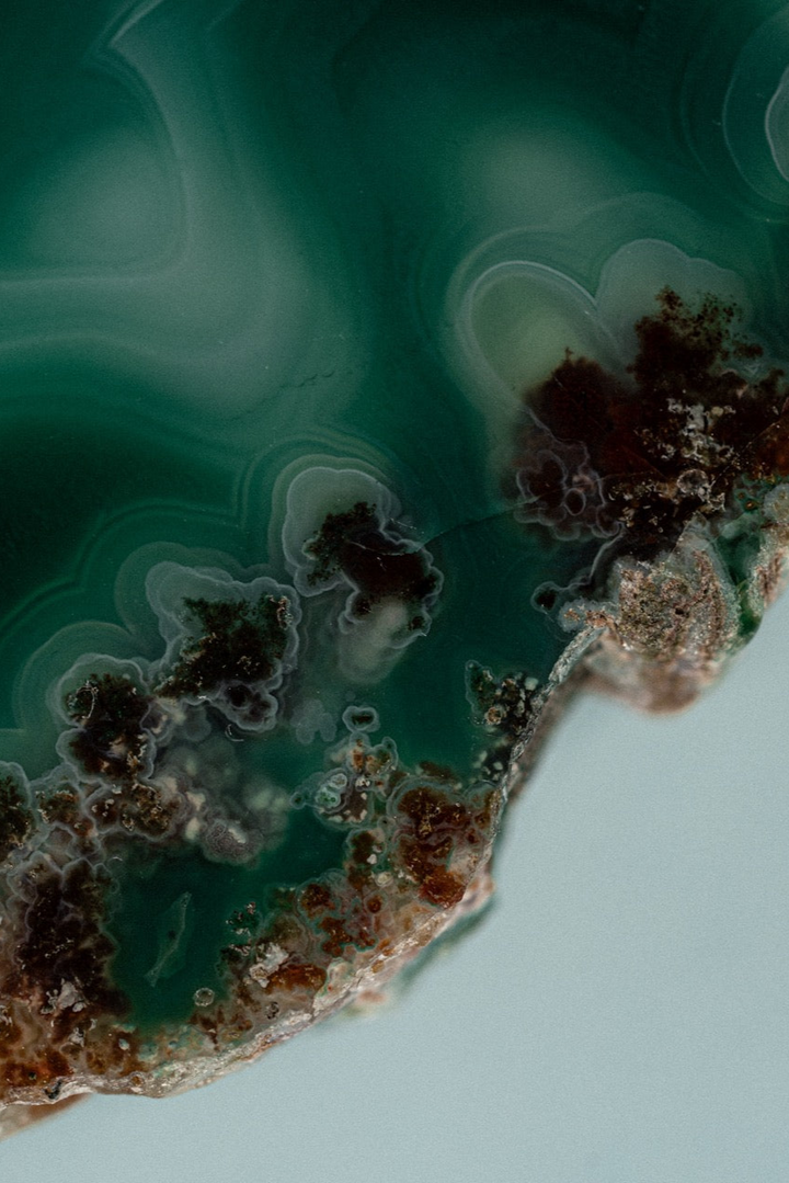 Close-up of a mineral with green and brown patterns