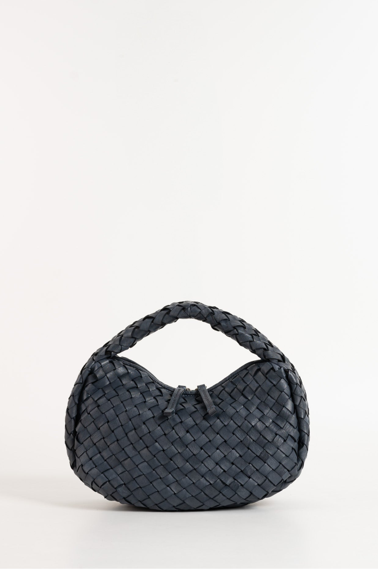 Black woven handbag on a white background