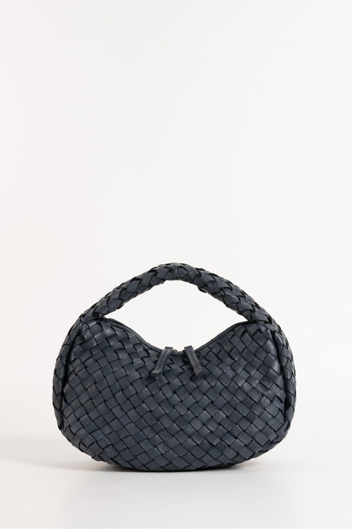 Black woven handbag on a white background
