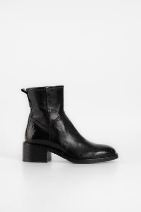 Black ankle boot on a white background