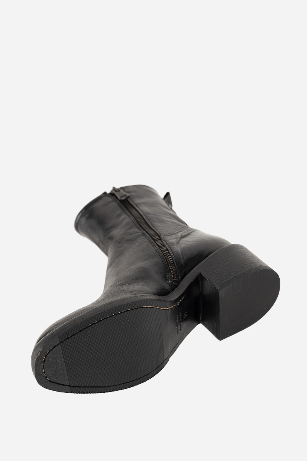 Black leather boot on a white background
