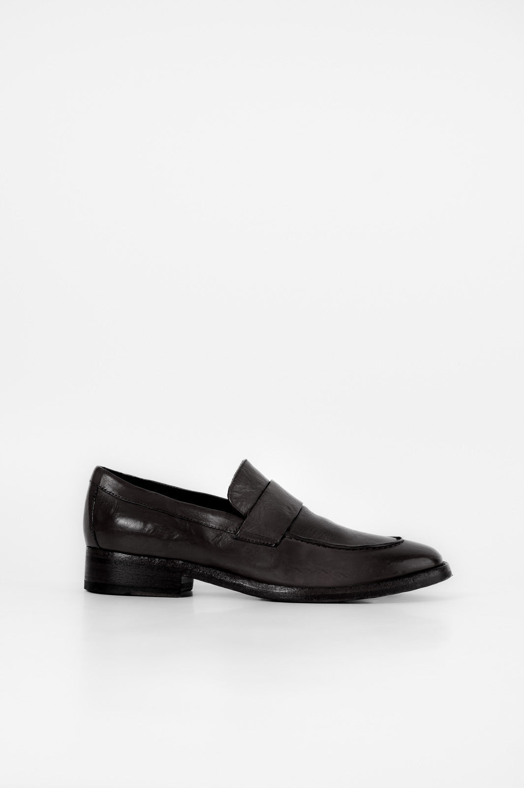 Black loafer shoe on a white background