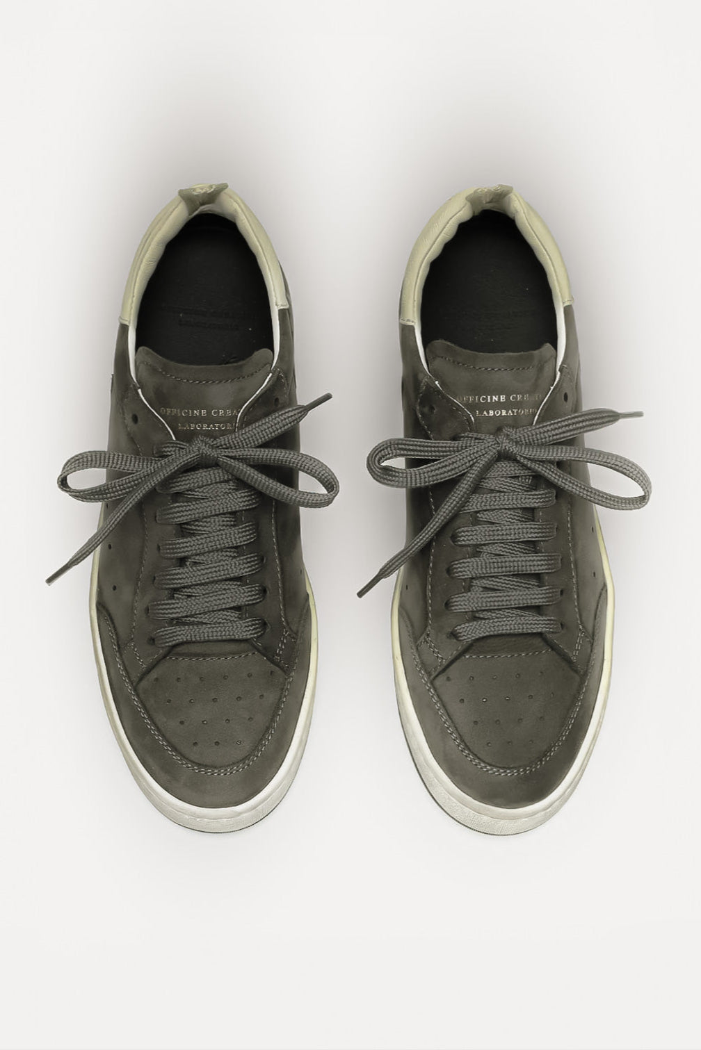 Pair of gray sneakers on a white background
