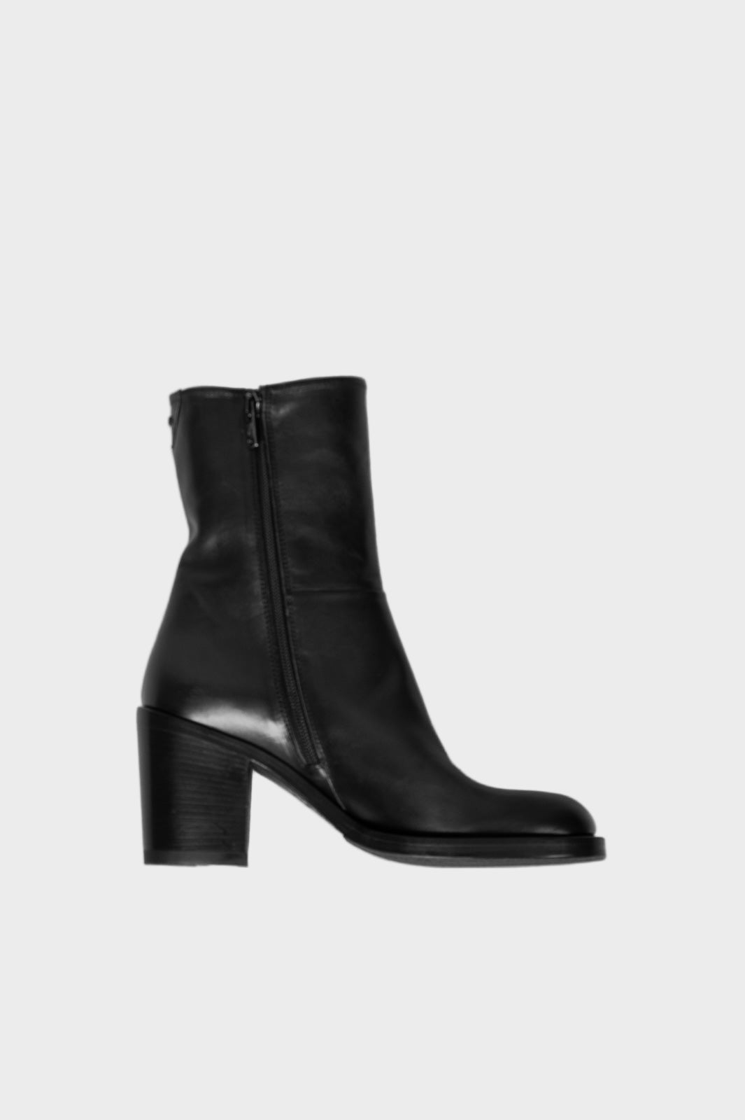 Black leather ankle boots on a white background